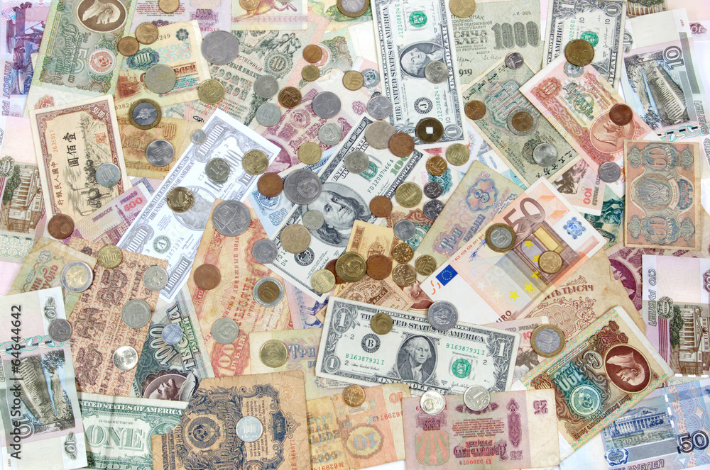 Obraz premium Many coins , banknotes of different countries and times. Money.