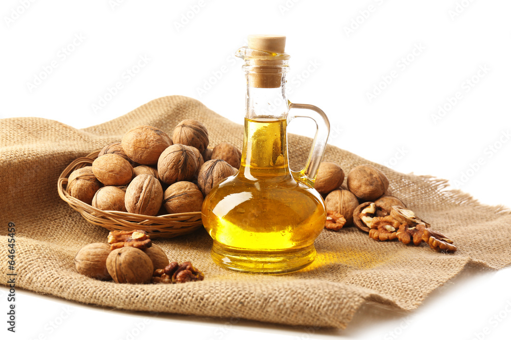 Walnut oil and nuts, isolated on white Walnut oil and nuts, isolated on white