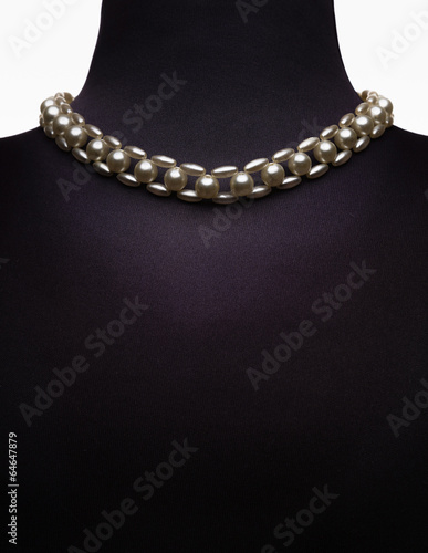 necklace type pearl on black mannequin isolated on white