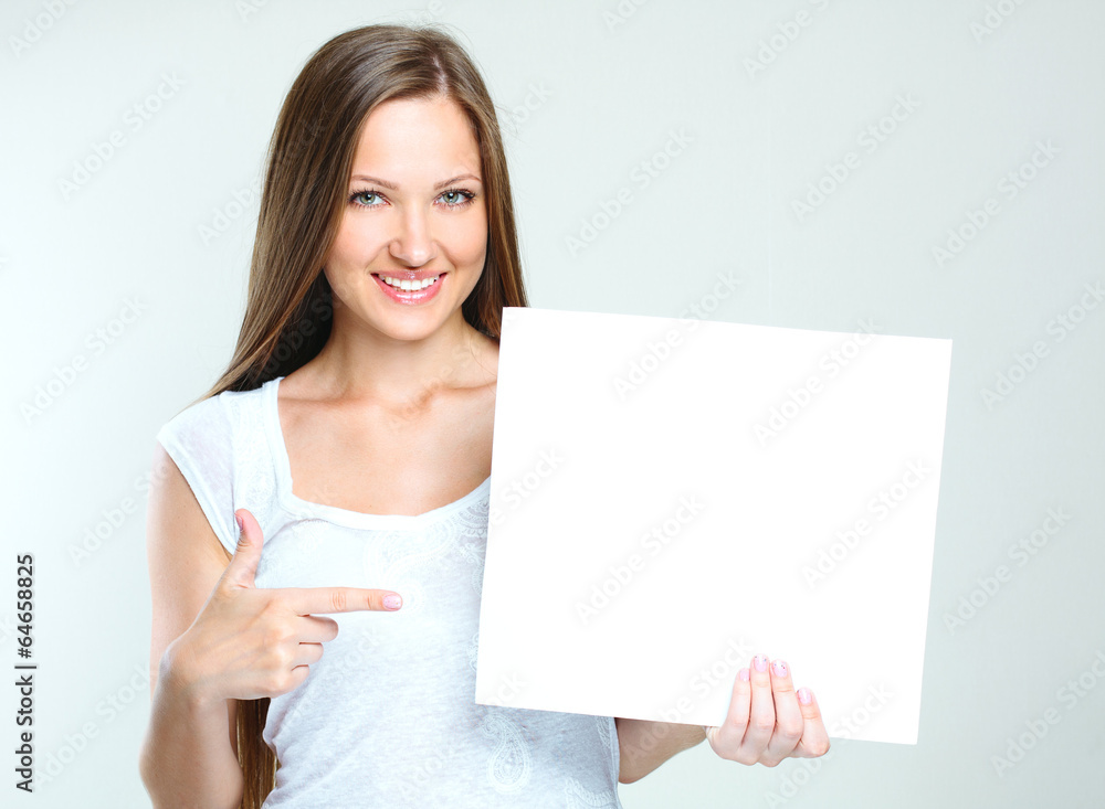 young smiling woman holding blank card young smiling woman holding blank card