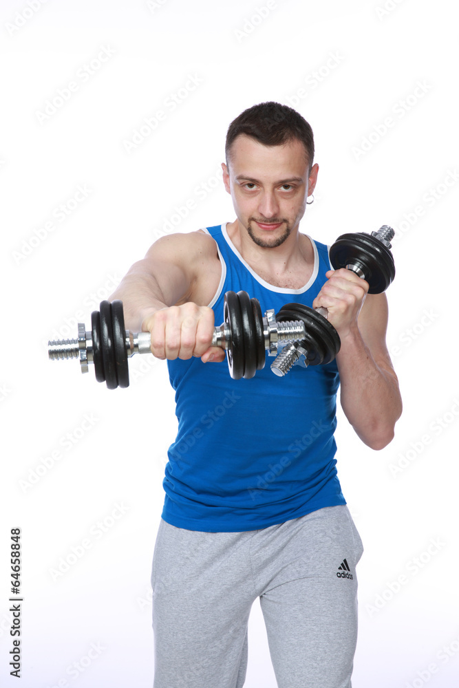 Muscular man working out with dumbbells on white background Muscular man working out with dumbbells on white background