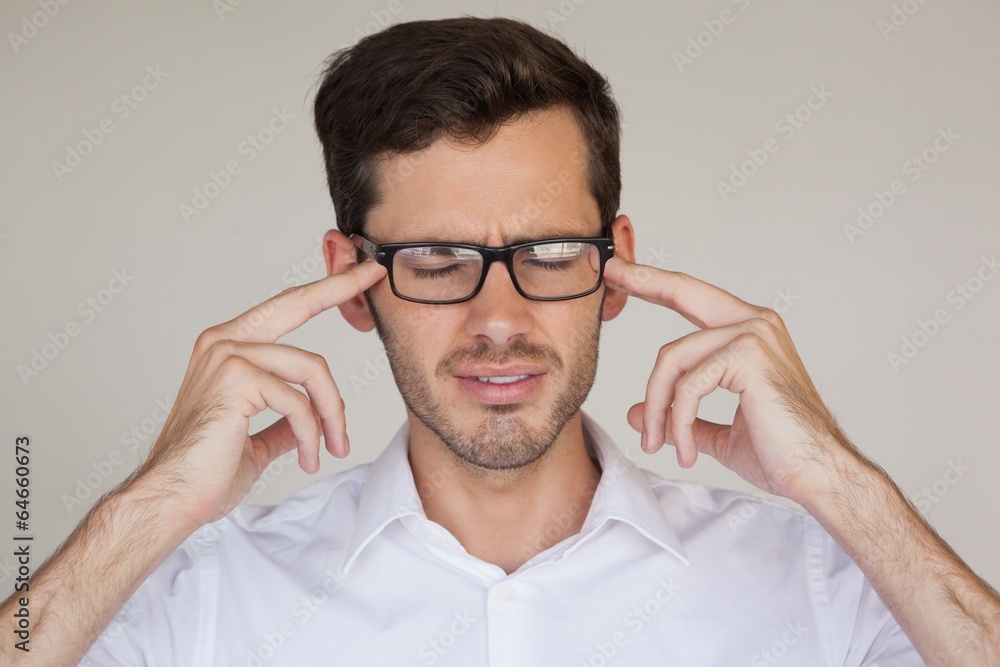 Casual businessman getting a headache Casual businessman getting a headache