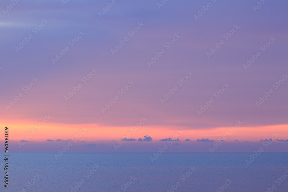 Dramatic minimalist pastel sunset sky and tropical sea image