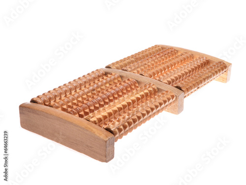 Wooden massager for feet isolated on white background. .