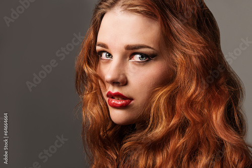 Long Curly Red Hair. Fashion Woman Portrait.