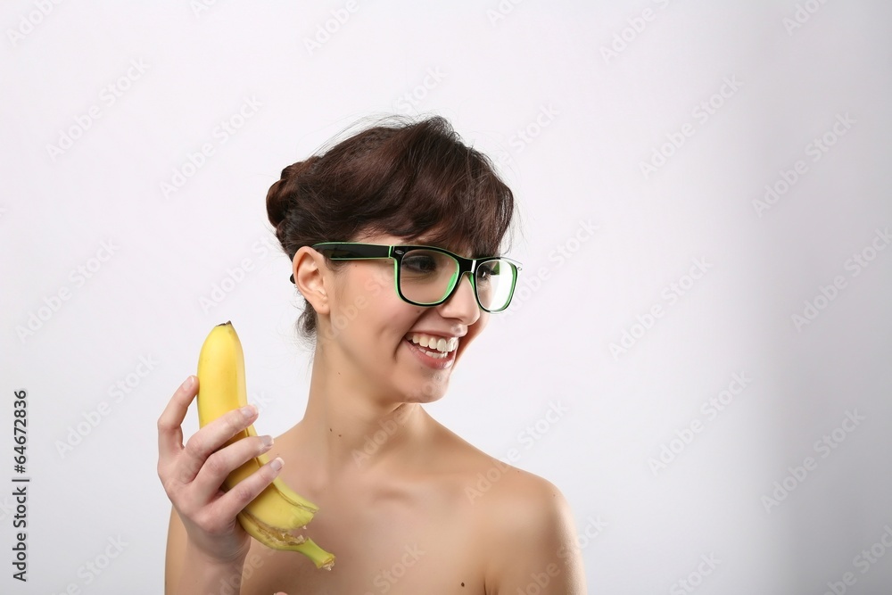 woman with nerd glasses and banana woman with nerd glasses and banana