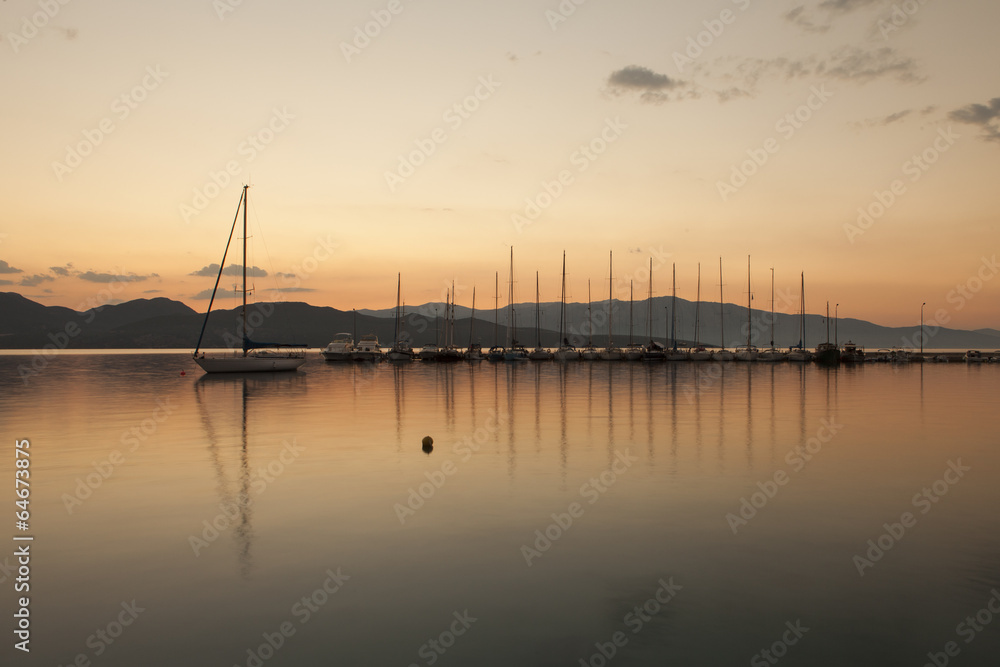 Yacht sailing against sunset. Holiday lifestyle landscape with s