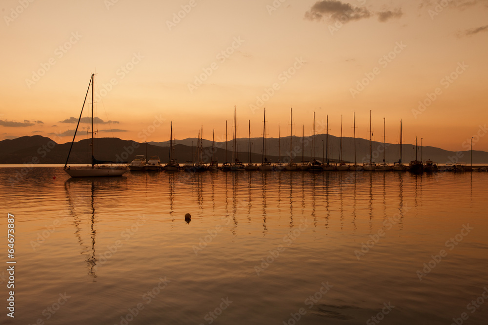 Yacht sailing against sunset. Holiday lifestyle landscape with s