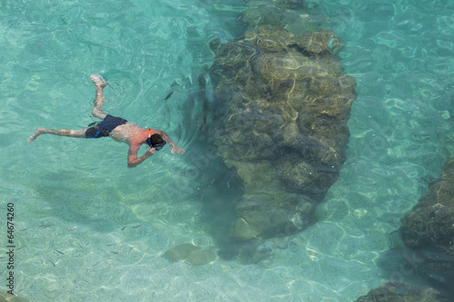 Unrecognizable man snorkeling in water in Lefkada, Greece