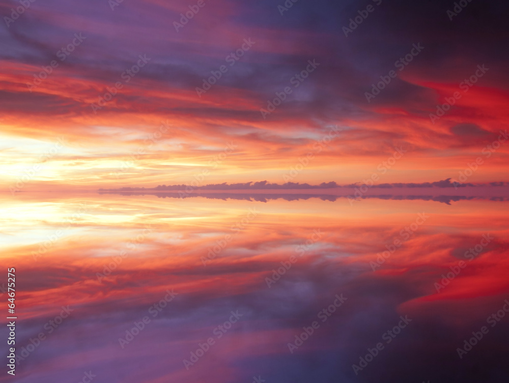 Reflection of dramatic and colorful clouds