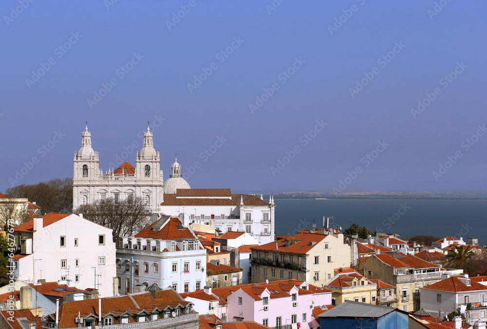 View on the old roofs and basilica in the center of Lisbon