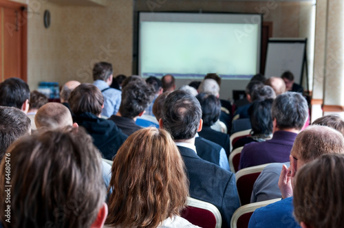 people sitting rear at the business conference