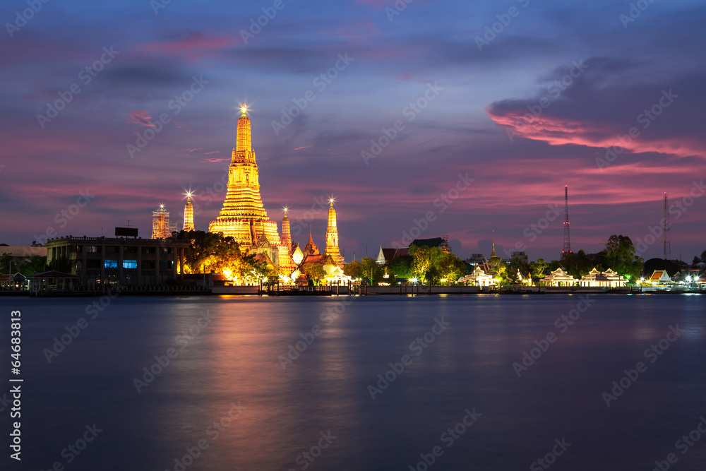 The beautiful temple along the Chao Phraya river at twilight