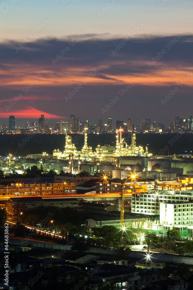 Oil refinery with sunset background