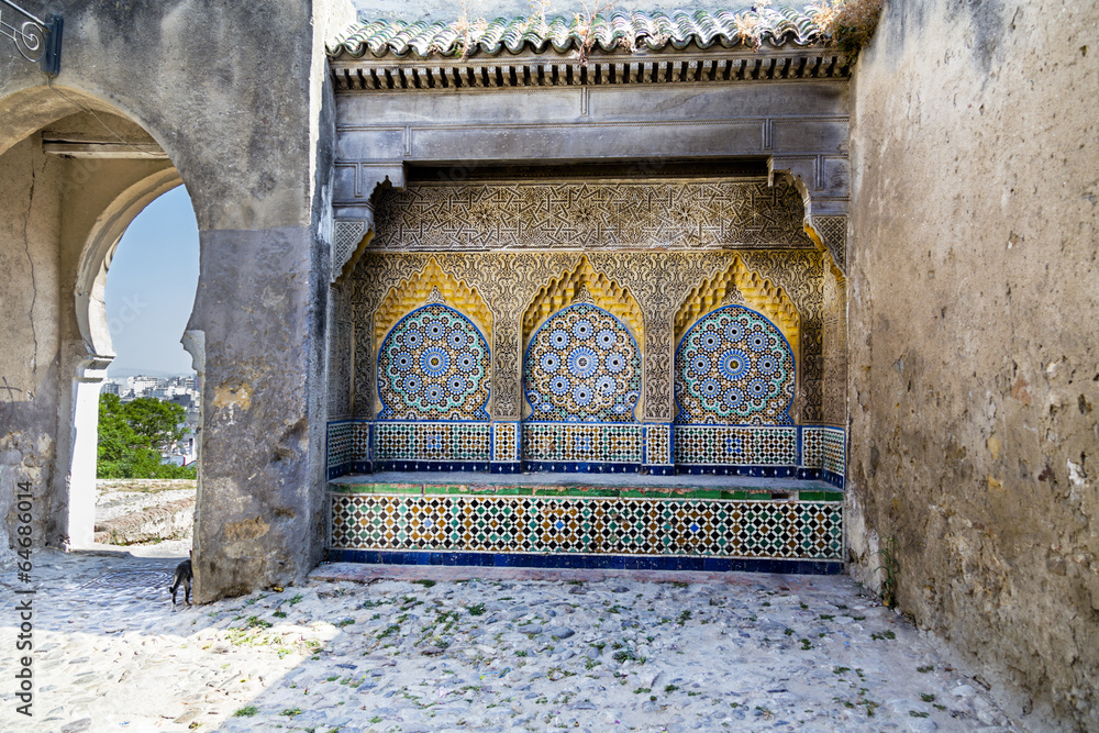 Fototapeta premium Tiled and carved alcove in Casbah, Tangier with distant skyline