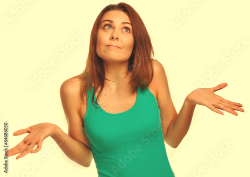 woman throws her hands she did not understand surprised looks up