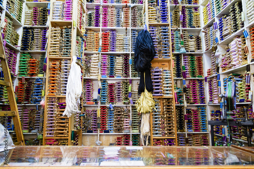 Shelves of colorful cotton reels in Tangier, Morocco