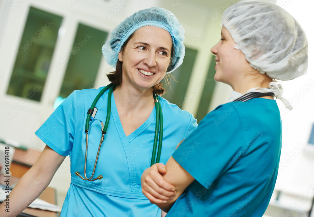 surgeons women in operation room surgeons women in operation room