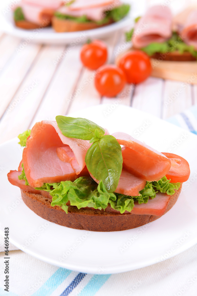 Delicious sandwich with lettuce and ham Delicious sandwich with lettuce and ham