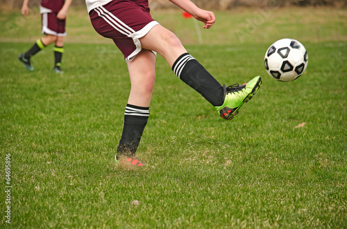 soccer player kicking a ball © driftwood