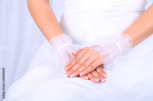 Wedding gloves on hands of bride, close-up