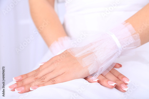 Wedding gloves on hands of bride, close-up