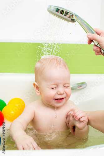 baby taking bath with tempe...