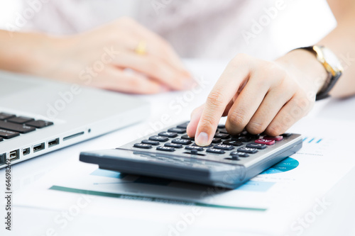 Hands of business woman with laptop computer keyboard. Accountin