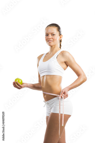 young athletic woman measuring waist © adam121