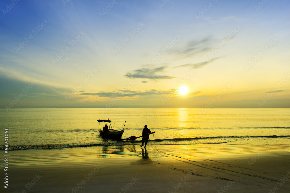 fisherman at beach via great sunrise