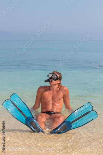 Funny scuba diver at the beach