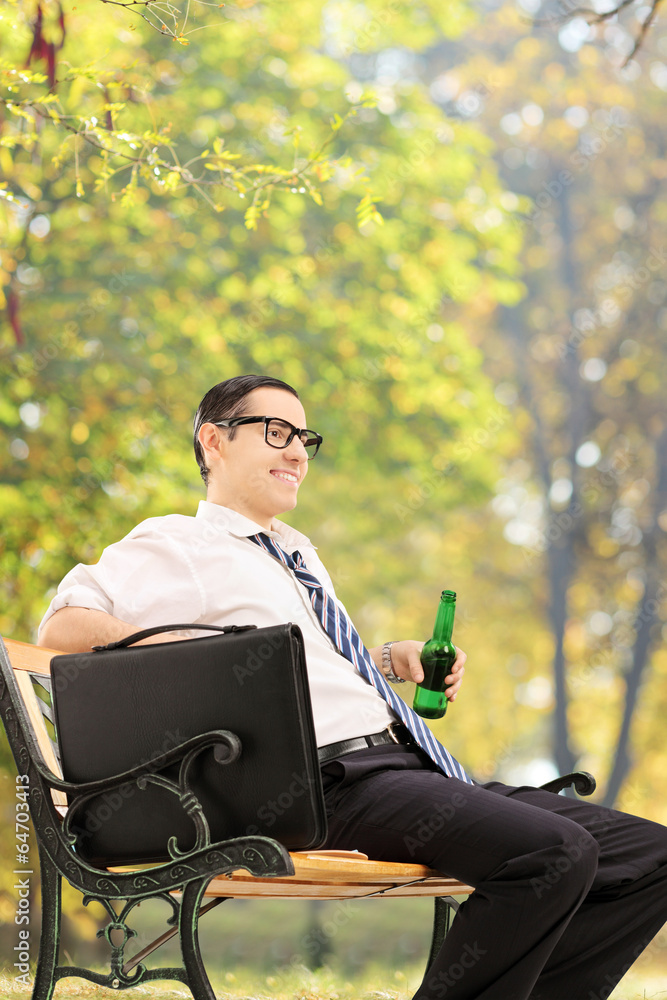 Relaxed businessman taking a break in park Relaxed businessman taking a break in park