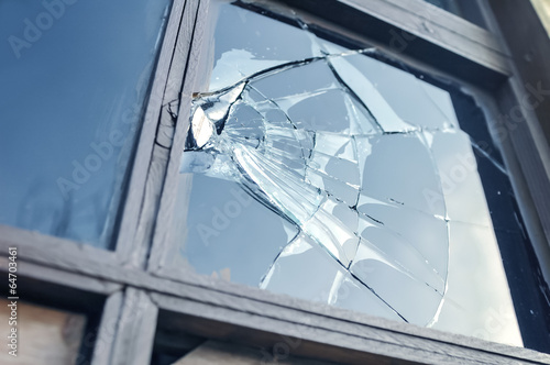 broken glass in a window frame photo