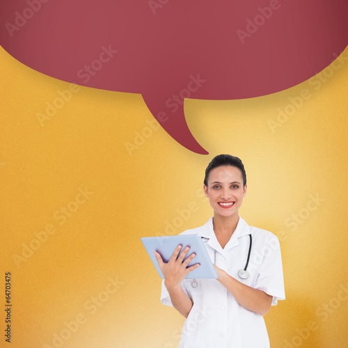 Composite image of pretty nurse using tablet pc with speech bubb photo