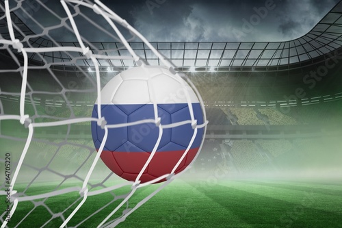 Football in russia colours at back of net