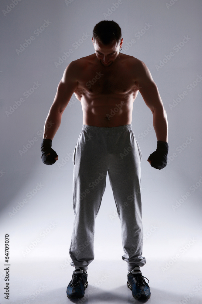 Full length portrait of a boxer preparing for training Full length portrait of a boxer preparing for training