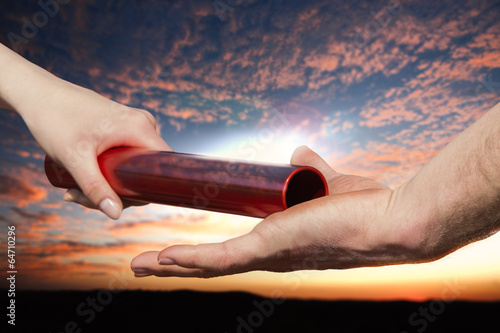 Tableau sur toile handing over baton sky