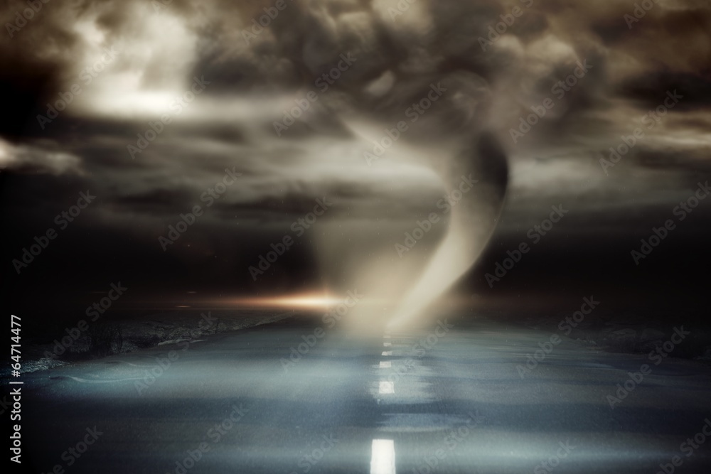 Stormy sky with tornado over road
