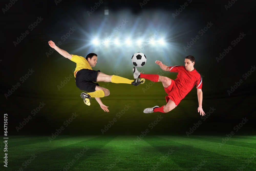 Football players tackling for the ball Football players tackling for the ball