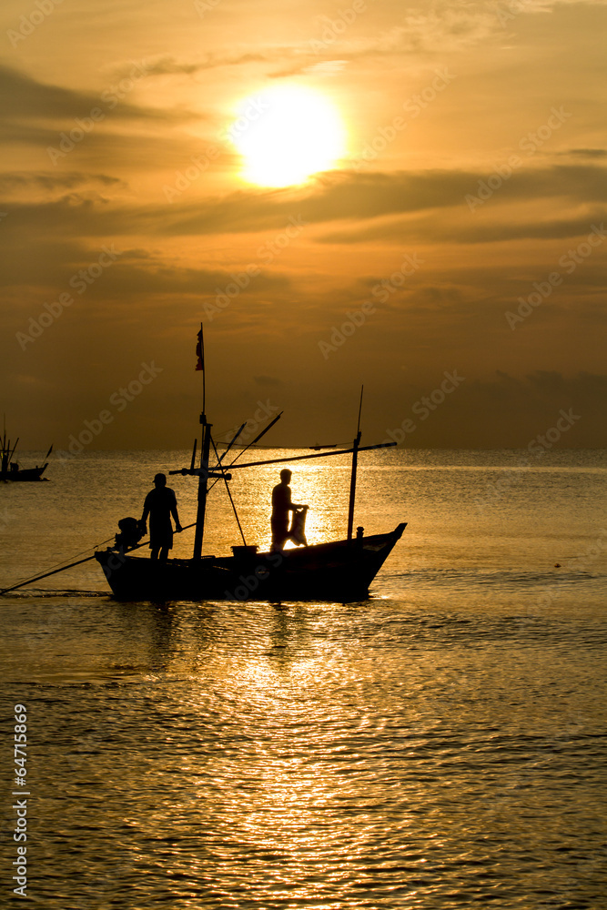 Fisherman silhouette in sea at sunrise , Thailand