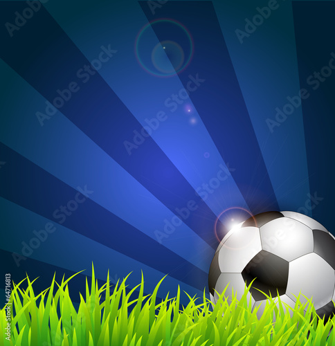 Soccer ball on grass background