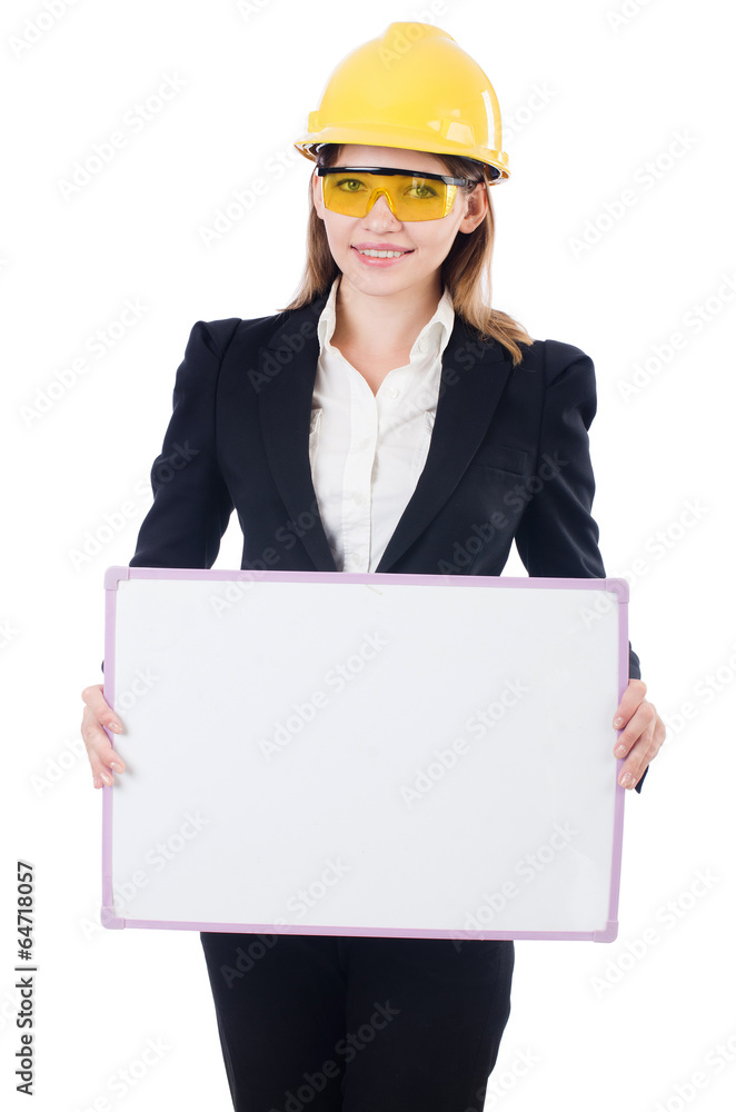Pretty businesswoman with hard hat and blank board isolated on Pretty businesswoman with hard hat and blank board isolated on