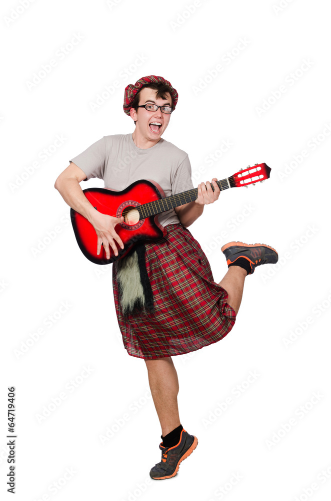 Scotsman playing guitar isolated on white Scotsman playing guitar isolated on white