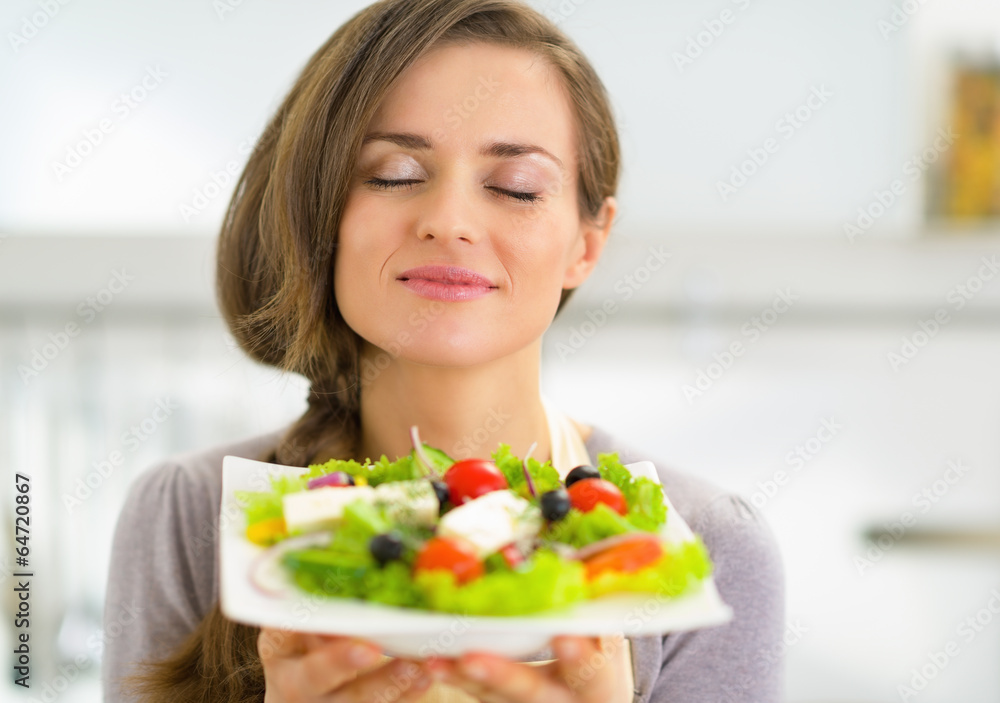 Portrait of young housewife enjoying fresh salad Portrait of young housewife enjoying fresh salad