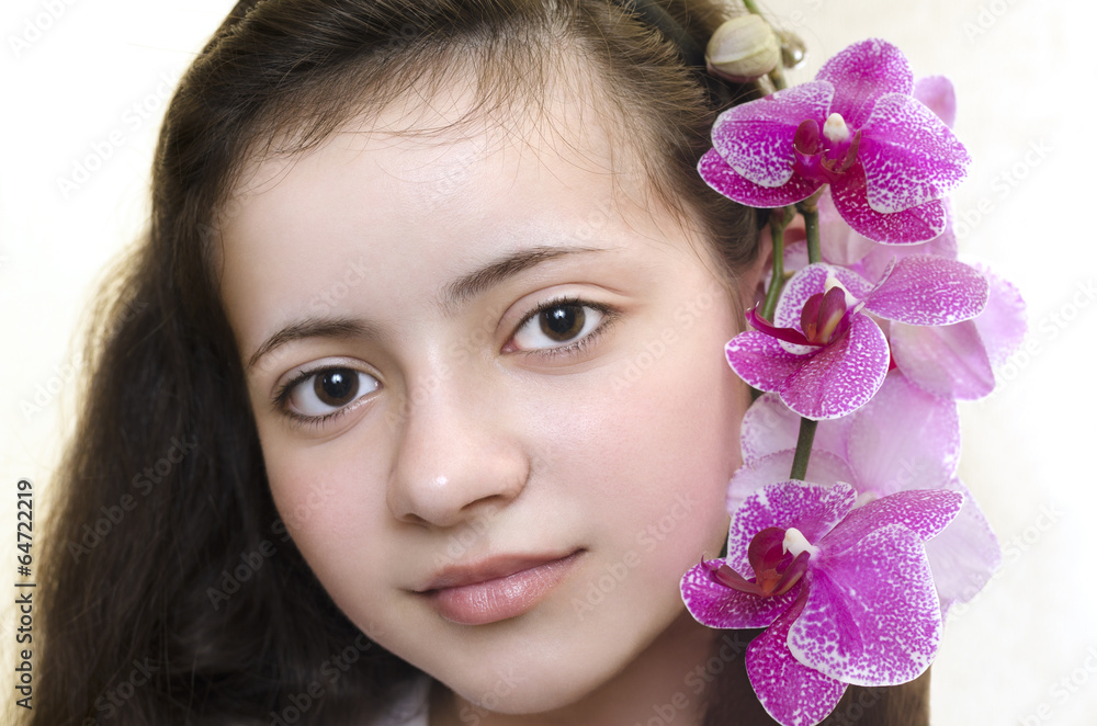young woman with orchid in her hair