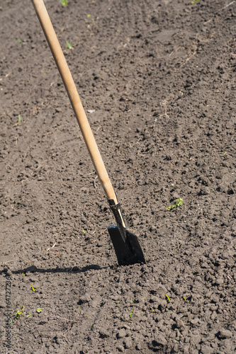 toil work of ground. spade insert soil