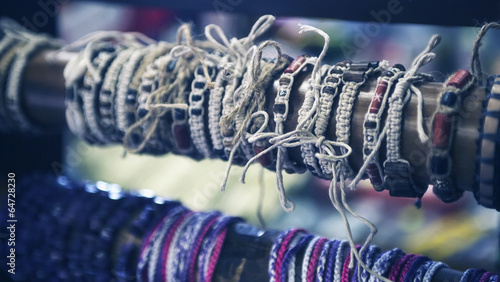 Bracelets and baubles in shop. Filtered stylized image photo