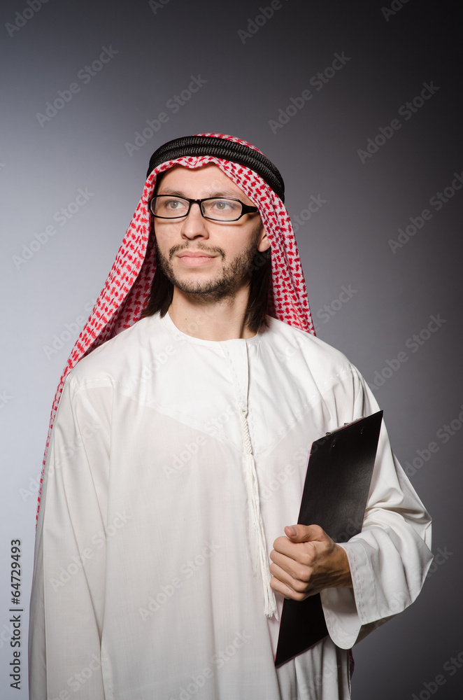 Arab man with paper binder Arab man with paper binder