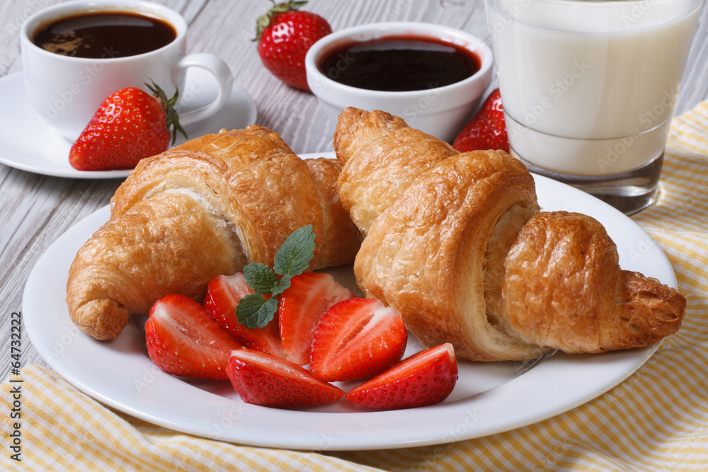 Croissants with strawberry, coffee and milk - healthy breakfast Croissants with strawberry, coffee and milk - healthy breakfast
