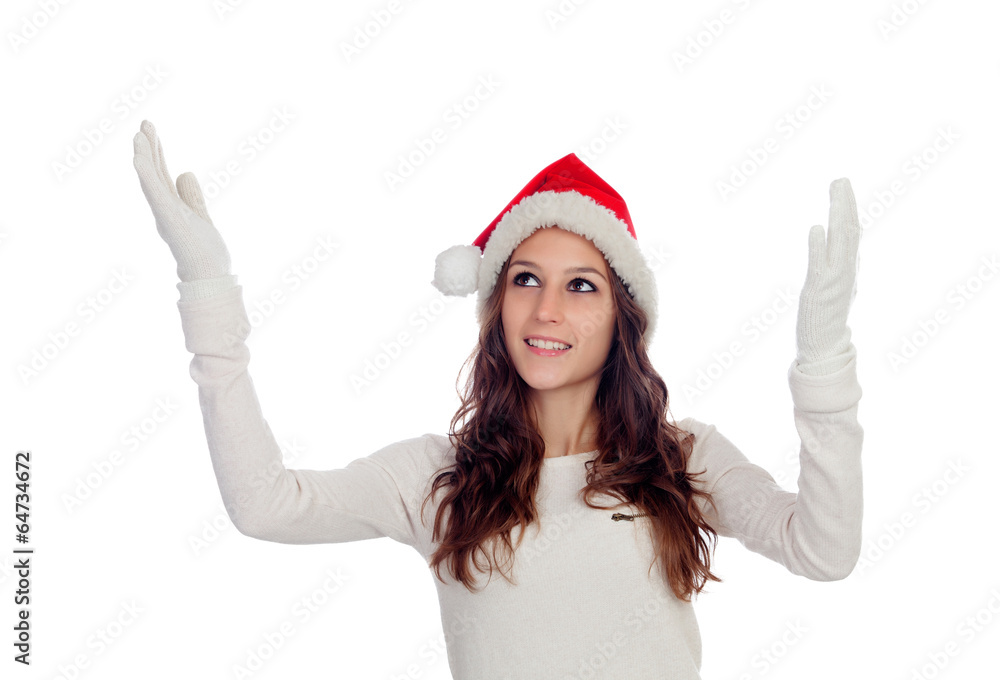 Attractive casual girl with Christmas hat extending her arms Attractive casual girl with Christmas hat extending her arms